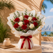 Pink and white roses with pink lilies in a blush wrap