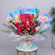 Blue Bouquet of flowers with various items including a doll and books on a small table.