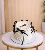 Elegant White Vanella Cake with Black Ribbon same day cake delivery Dubai
