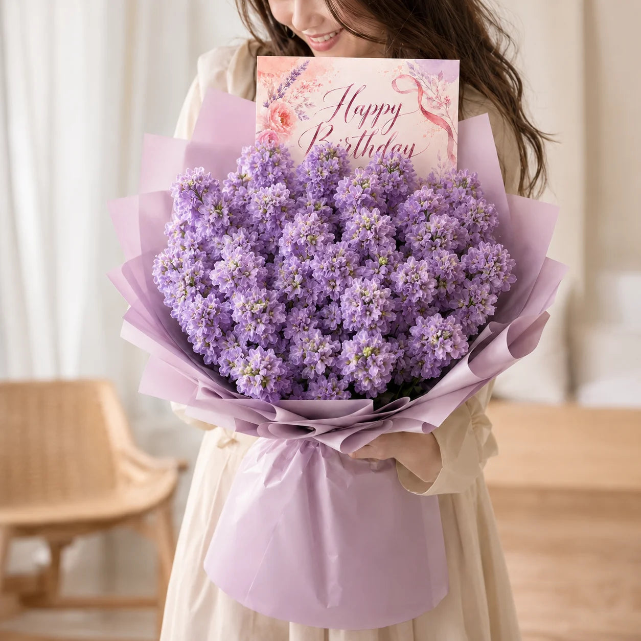 Girl holding a Happy Birthday Purple Flowers Bouquet with paper saying "Happy birthday"