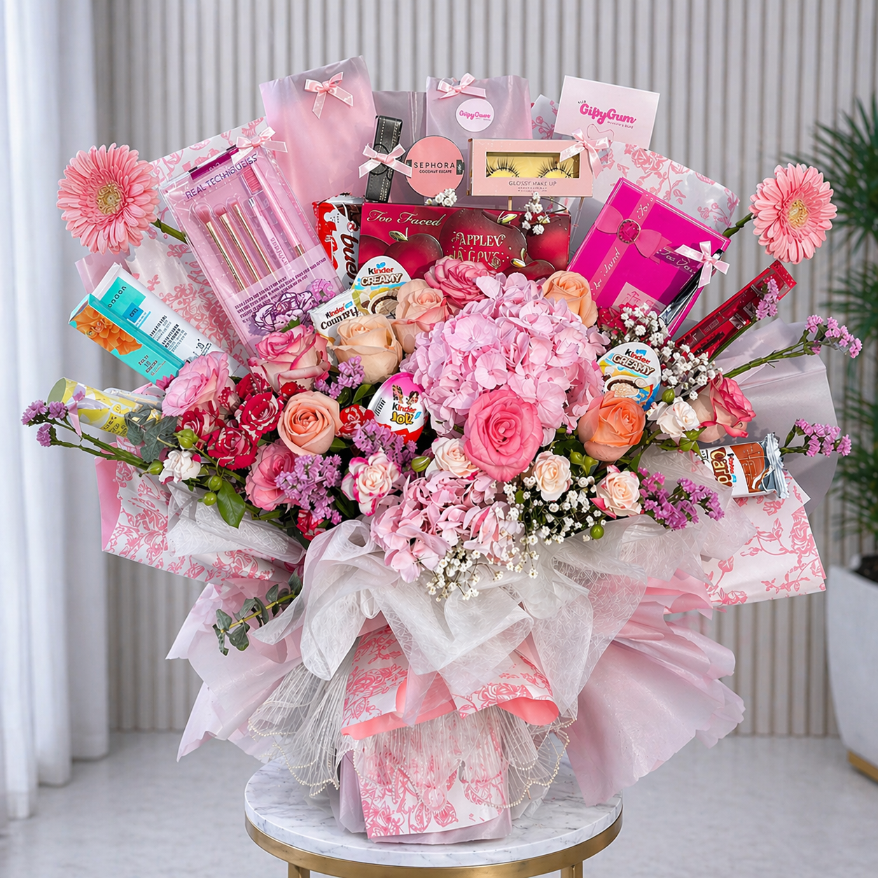 VIP Makeup Bouquets of pink flowers with various gifts and products on a marble table.
