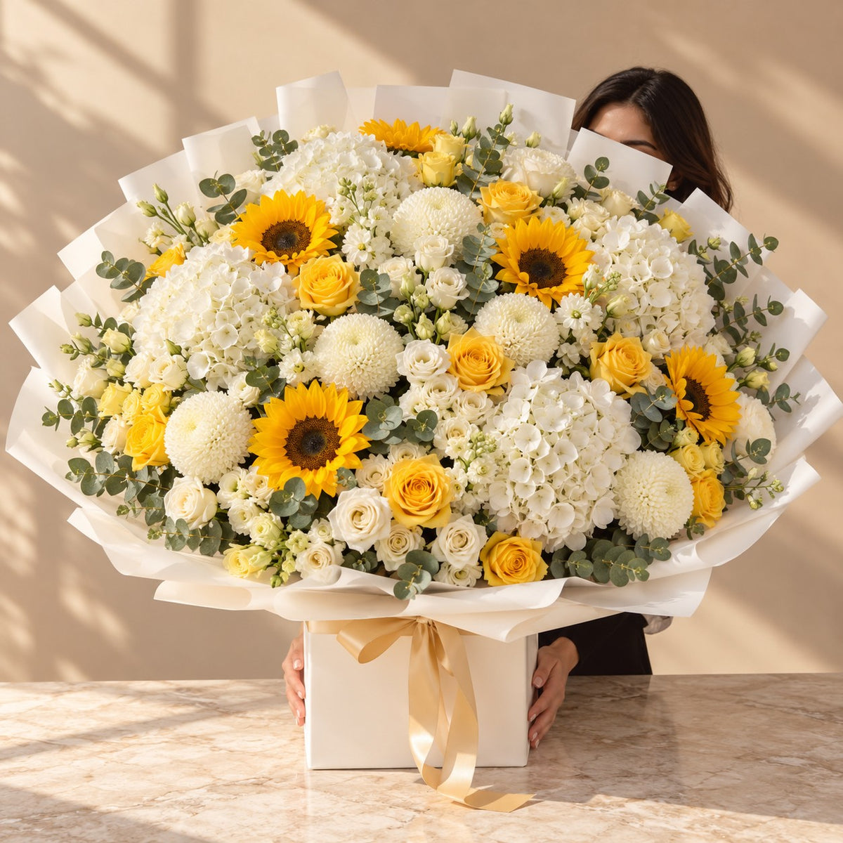 Golden Hour luxury sunflower and white hydrangea bouquet with yellow roses in a white gift box – same day flower delivery Dubai